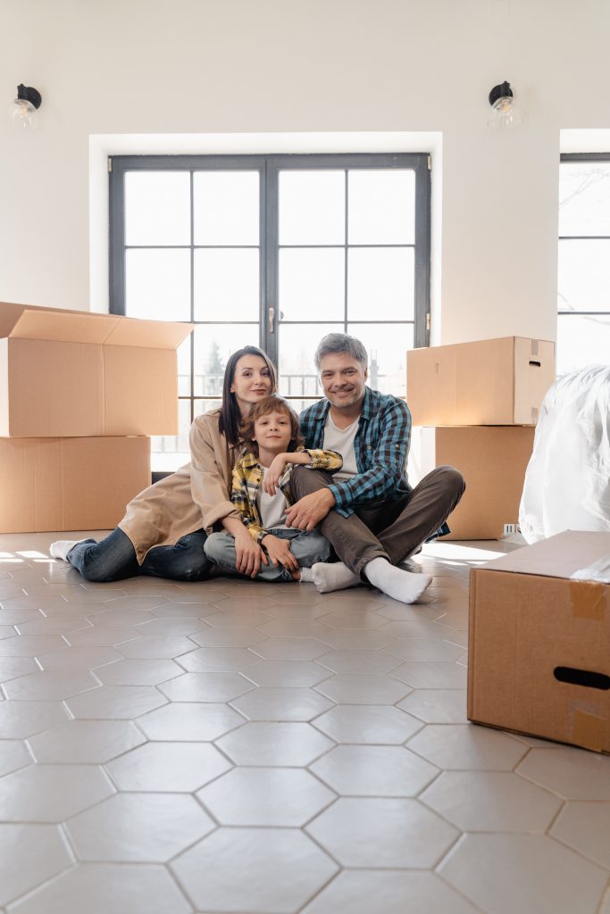 family surrounded by moving boxes